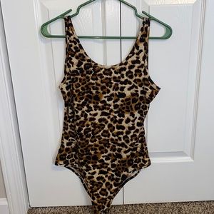 leopard print body suit. size large